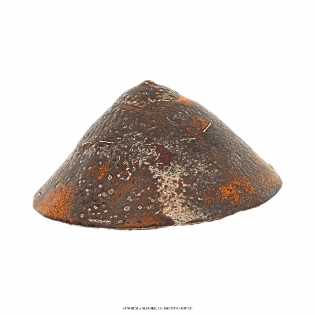 Oyan (Breast), Ìnù mí dùn | 2025  Sculpture (kiln-fired enamel glass on silversmithed copper metal)  9.12 x 44.4cm by Artist Tomilola Olumide